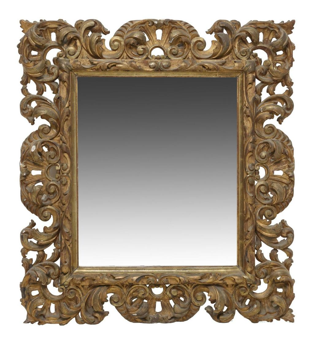 ITALIAN BAROQUE STYLE SCROLLED FOLIATE WALL MIRROR: Italian Baroque style wood wall mirror, having pierced rectangular frame with scrolled foliate motifs, encasing beveled mirror plate, remnants of gilt paint, approx 39"h, 36"w, 24.7lbs Start Price: $2