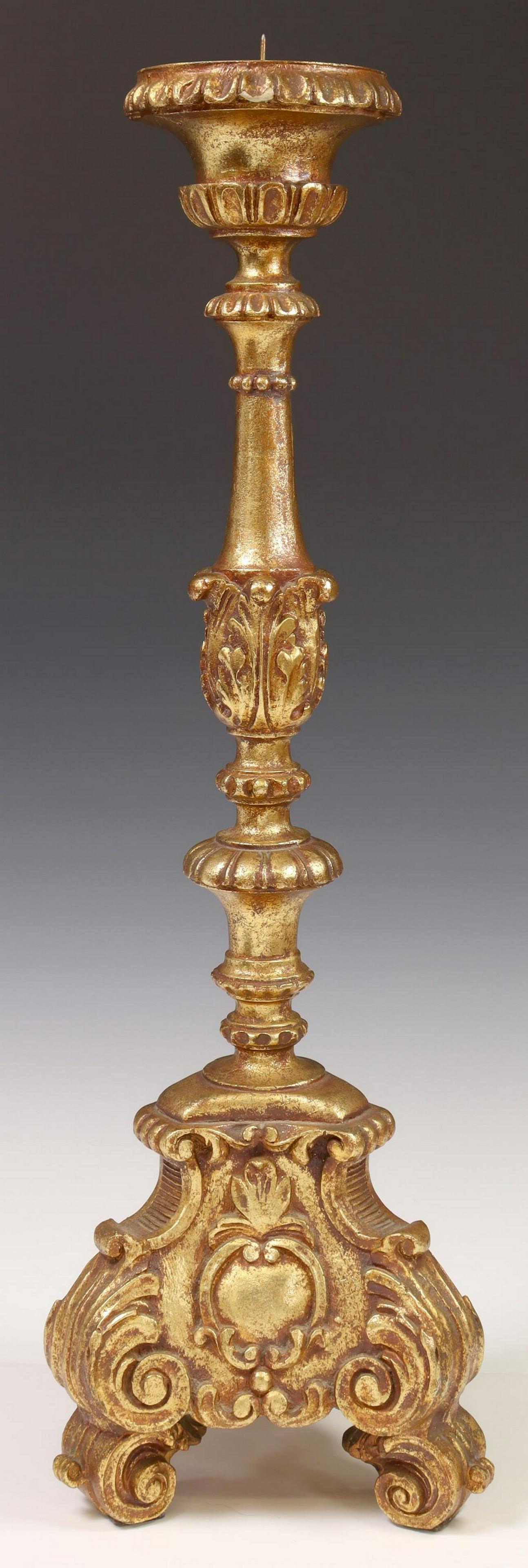 BAROQUE STYLE GILT COMPOSITION CANDLE PRICKET: Baroque style gilt composition candle pricket, 20th c., with acanthus leaf elements, rising on a volute base, small chip to underside of top edge, approx 26.5"h, 8.5"w, 8.5"d, 8lbs Start Price: $50.00