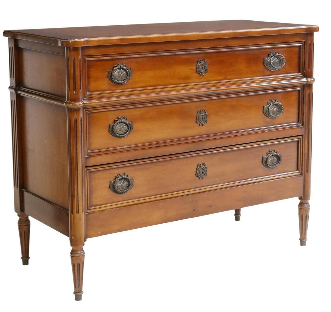 FRENCH LOUIS XVI STYLE THREE-DRAWER COMMODE: French Louis XVI style commode, 20th c., three drawers framed by fluted corner posts, rising on tapered legs, approx 32.25"h, 40.75"w, 18.5"d Start Price: $450.00