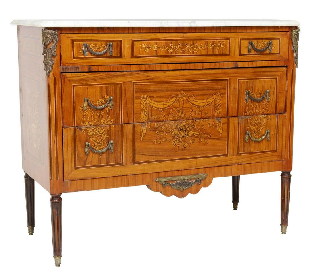 LOUIS XVI STYLE MARBLE-TOP MARQUETRY COMMODE: Louis XVI style marquetry commode, early 20th c., having shaped marble top, over three drawers, with central inlaid musical instruments, flanked on both sides by floral and foliate marquetry, rising o