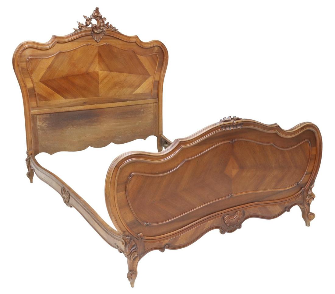 FRENCH LOUIS XV STYLE MATCHED-VENEER BED: French Louis XV style matched veneer bed, 20th c., having carved rocaille and floral crest, over shaped frame, rising on cabriole legs, ending on whorl feet, small loss to crest, exterior: approx 60"h
