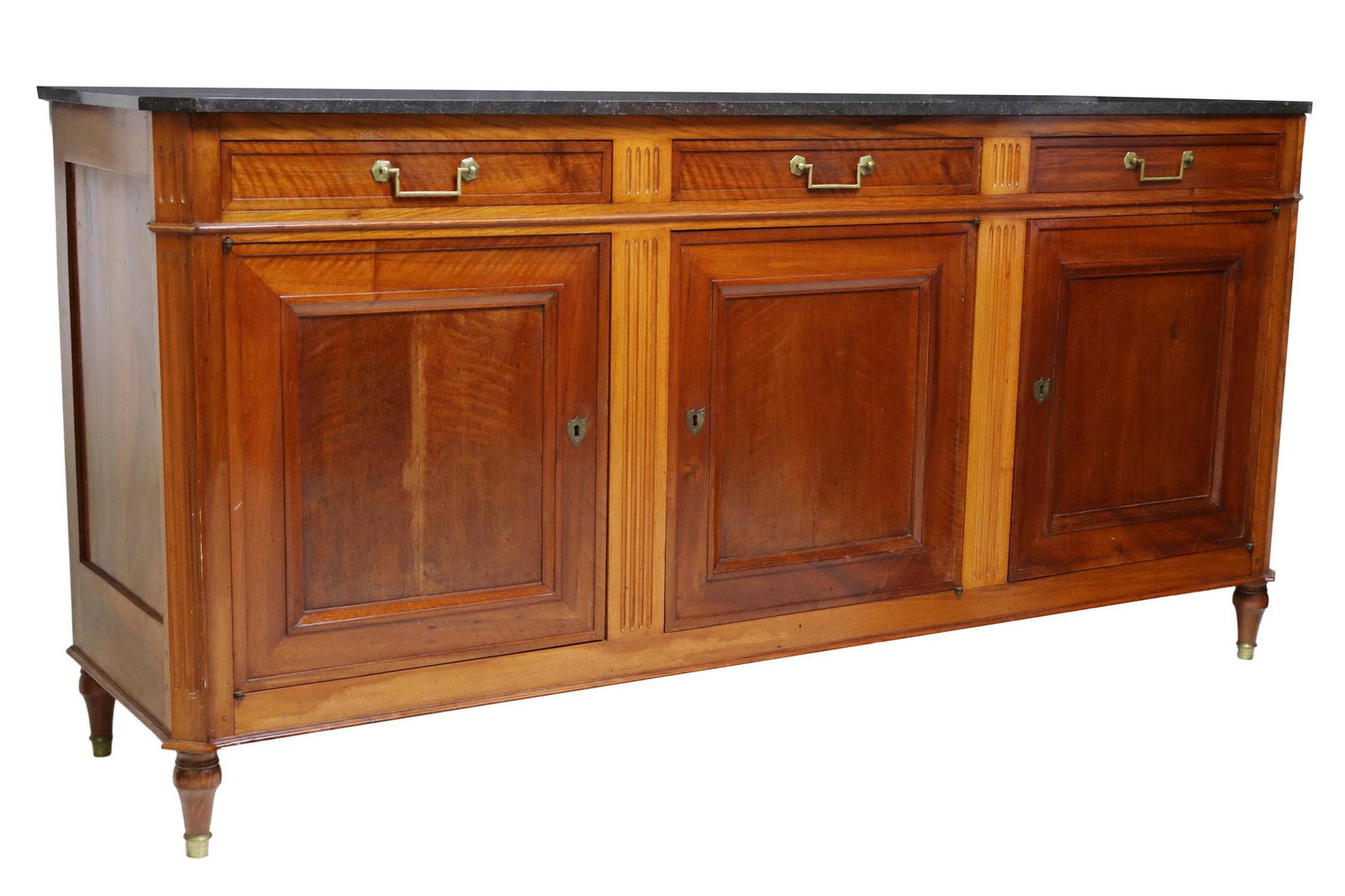 FRENCH LOUIS XVI STYLE MARBLE-TOP SIDEBOARD: French Louis XVI style marble-top walnut sideboard, early 20th c., three drawers, over three cabinet doors, framed by fluted corner posts, rising on tapered legs, approx 40.5"h, 85"w, 22.5"d Start Pri