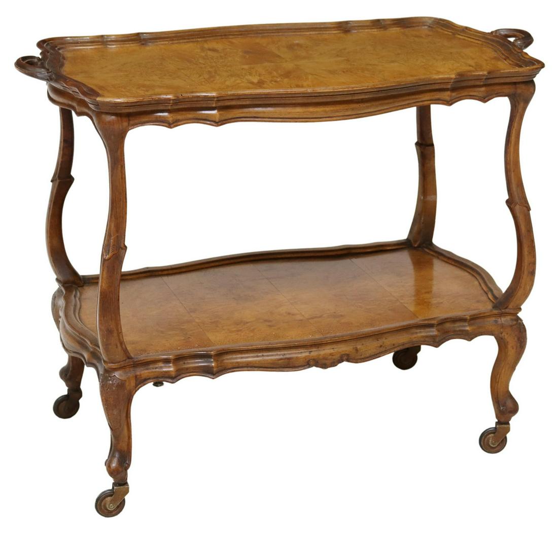 ITALIAN LOUIS XV STYLE FIGURED WALNUT SERVICE CART: Italian Louis XV style figured walnut bar car/ service trolley, 20th c., having shaped top with dual side handles, over medial shelf, rising on cabriole legs, ending on whorl feet, further raised on c