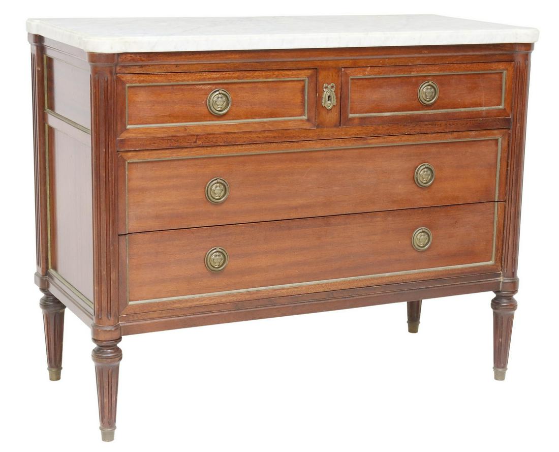 FRENCH LOUIS XVI STYLE MARBLE-TOP MAHOGANY COMMODE: French Louis XVI style marble-top mahogany commode, 20th c., projecting fluted corner posts, two half drawers, over two long drawers, rising on tapered legs, approx 33.75"h, 42.75"w, 19.25"d Start Pri