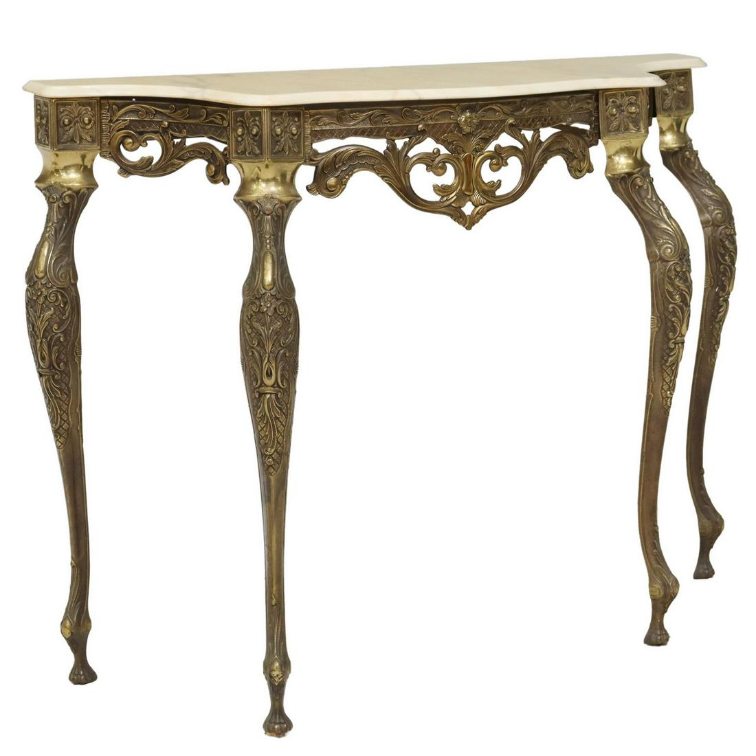 ITALIAN MARBLE-TOP & GILT METAL CONSOLE TABLE: Italian gilt metal console table, 20th c., having shaped marble top, over pierced foliate apron, rising on cabriole legs, ending on shaped feet, approx 32"h, 43.5"w, 14.25"d Start Price: $100.00