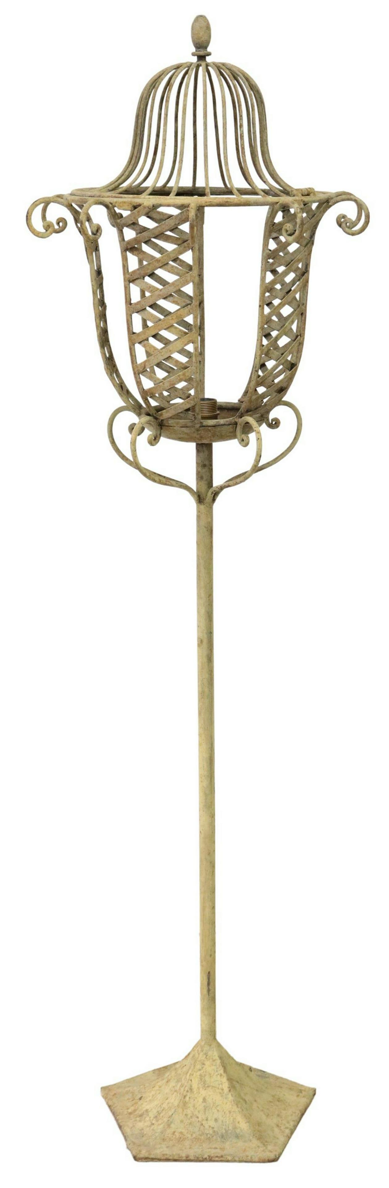 TALL LANTERN STYLE IRON STANDING FLOOR LAMP: Iron floor lamp, 20th c., lantern style shade, on a five-sided base, in need of wiring, approx 66"h, 19.5"diam Start Price: $150.00