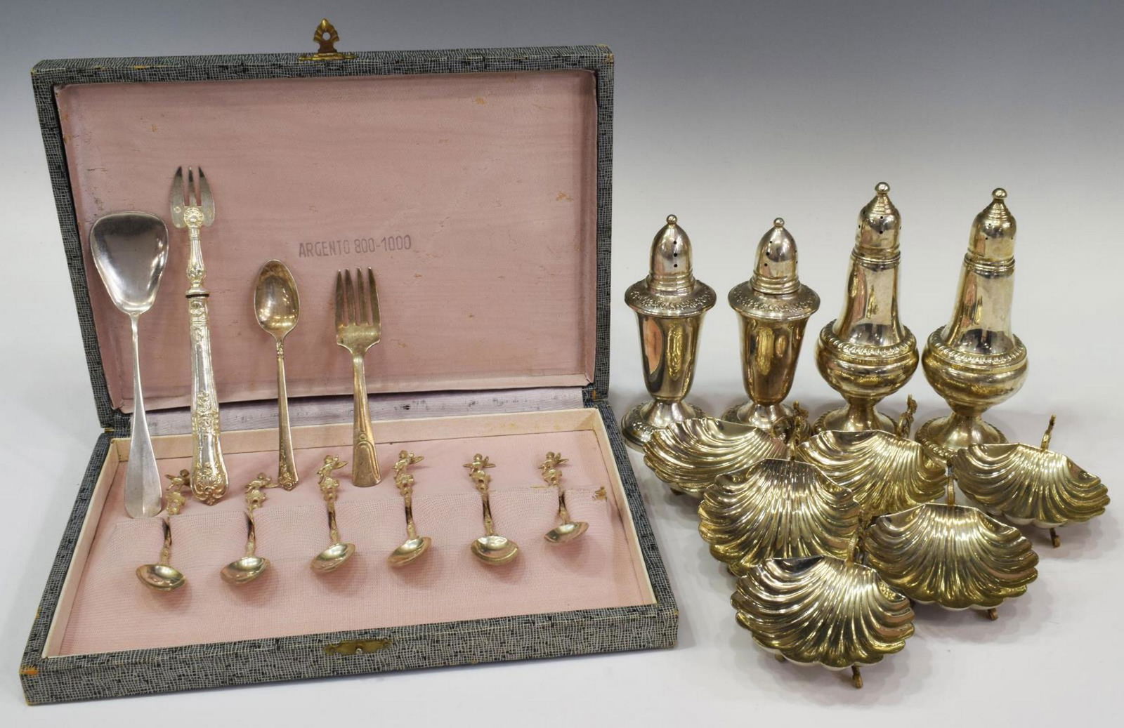 (20) STERLING & OTHER TABLEWARE SHELL SALT CELLARS: (lot of 20) Sterling silver and other metal tableware, including: (6) Italian shell-form salt cellars, stamped Italy, approx 1.5"h, 3.5"w, 2.75"d, (6) Italian Pompei 800 silver spoons, with winged cup