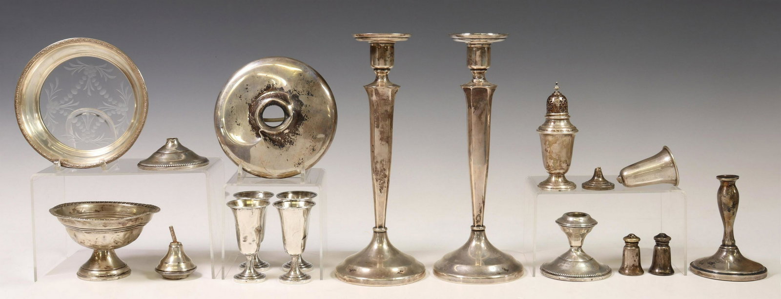 (LOT) STERLING SILVER WEIGHTED TABLEWARE, PARTS: (lot) Sterling silver tableware, all weighted, parts and pieces, all with dents and wear, highlights include: (2) candlesticks, with tapered standard, rising on flared base, (4) cordials, monogrammed 