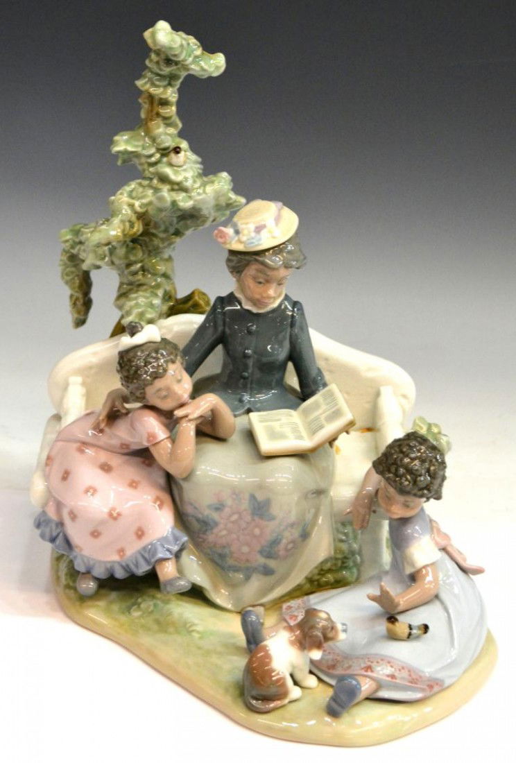 LLADRO PORCELAIN BLACK LEGACY COLLECTION FIGURE: Lladro porcelain figure from the 'Black Legacy Collection', "Family Roots," # 5371, issued: 1986, retired: 2007, charming grandmother reading to her two grandchildren on a park bench, retaining origin