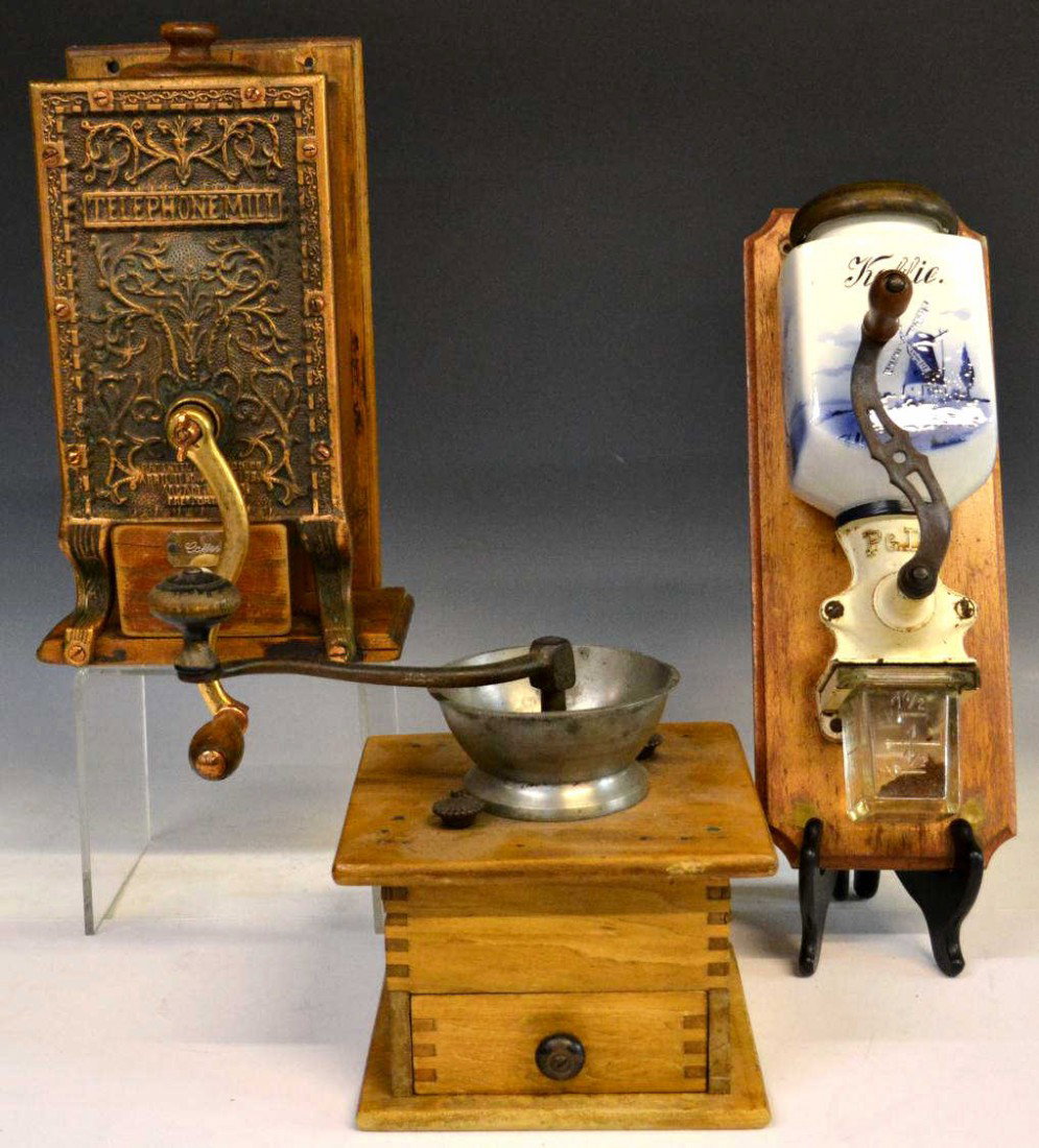 (3) COFFEE GRINDERS, TELEPHONE MILL, DELFT, WOOD: (lot of 3) Vintage coffee grinder group, comprising: (1) cast iron and wood Arcade MFG Co., Freeport Illinois, 'Telephone Mill', wall mountable, vine designs on metal front, dove tail case, small wood