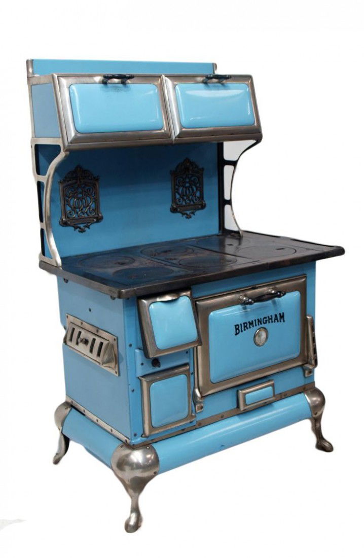 BLUE PORCELAIN & NICKEL STOVE, C. 1930: Birmingham wood cook stove, Robert F. Clark Company, Denver c. 1930, six burners, porcelain, cast iron with nickel accents, 62.5"h, 37.75"w, 25.25"d Start Price: $200.00