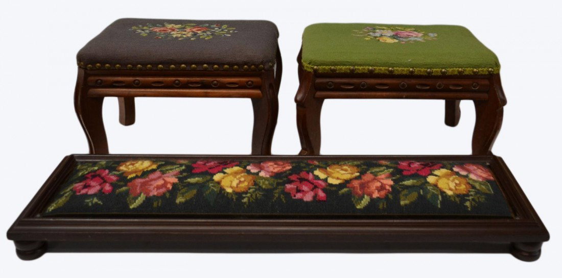 (3) GROUP NEEDLEPOINT & CARVED WOOD STOOLS: (lot of 3) Small stools with needlepoint tops wood bases: (1) low, long and narrow with forest green background and yellow and pink roses with brown velour ribbon border, 2"h, 31"w, 9.5"d; (1) purple