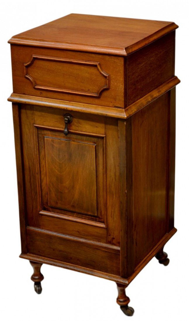 FITTED SEWING CABINET: English sewing cabinet,1920's, a lift top reveals buttoned upholstered lined storage, a lower paneled drop front with metal lined interior, 31.5"h, 14.75"w, 14.25"d Start Price: $50.00