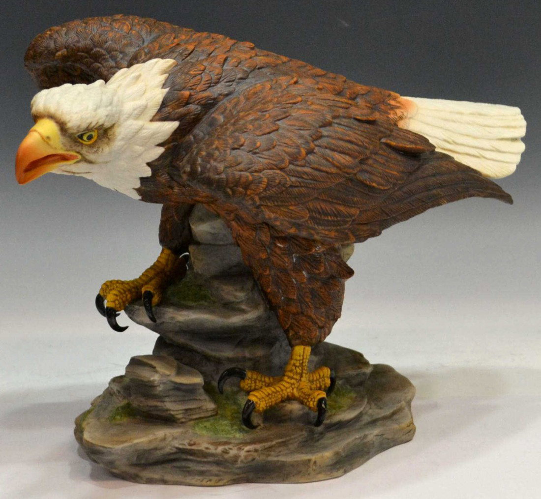 LARGE JOHN JAMES AUDUBON PORCELAINS BALD EAGLE: John James Audubon Porcelains Limited, 'American Bald Eagle', limited edition, numbered 611, detailed bald eagle on stacked rocks, and staring down at target, 9.5"h, 14"l, 5.5lbs Start Price: $50.00