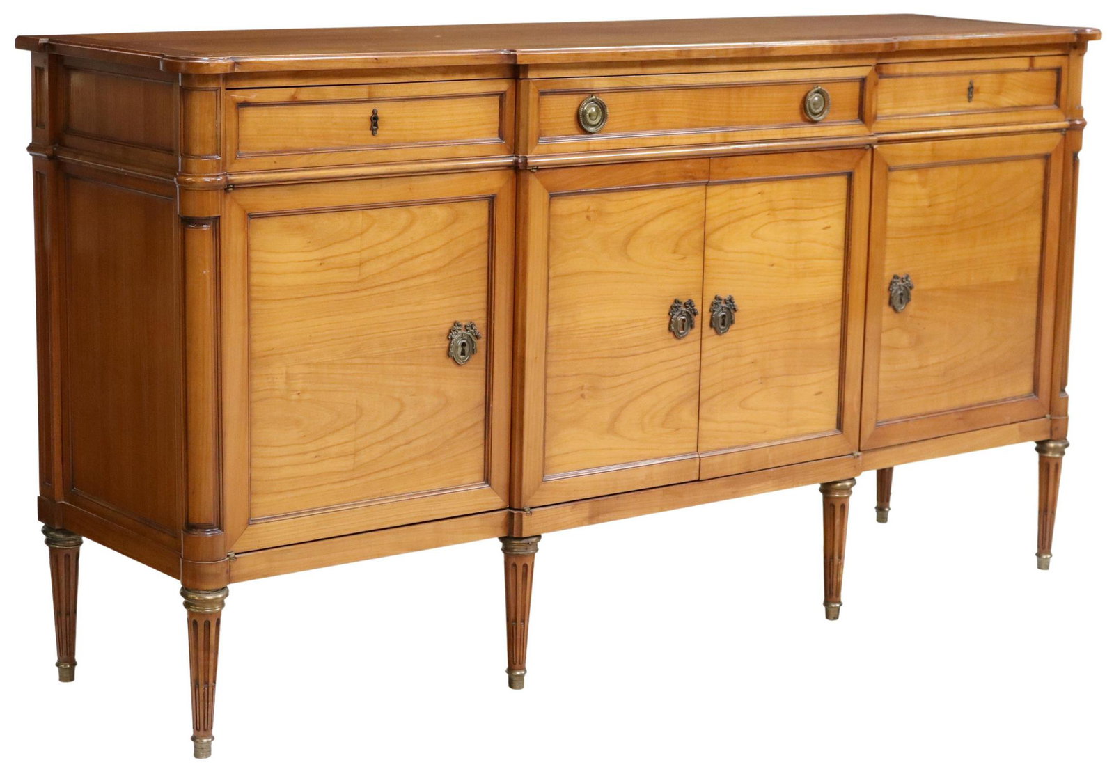 FRENCH LOUIS XVI STYLE FRUITWOOD SIDEBOARD: French Louis XVI style fruitwood breakfront sideboard, 20th c., three drawers, over four cabinet doors, interior shelves, rising on tapering fluted legs, back of case marked SF, approx 39.5"h, 75"w, 2