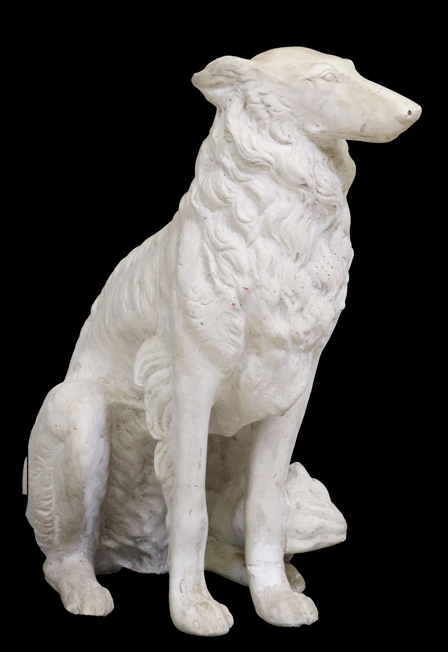 CAST STONE GARDEN STATUARY OF A SEATED DOG: Cast stone garden statuary, Seated Dog, possibly a Borzoi, having bushy tail, restoration to front left leg, approx 28.75"h, 27"w, 16.5"d **PLEASE NOTE: All of the cast stone and garden pieces in this