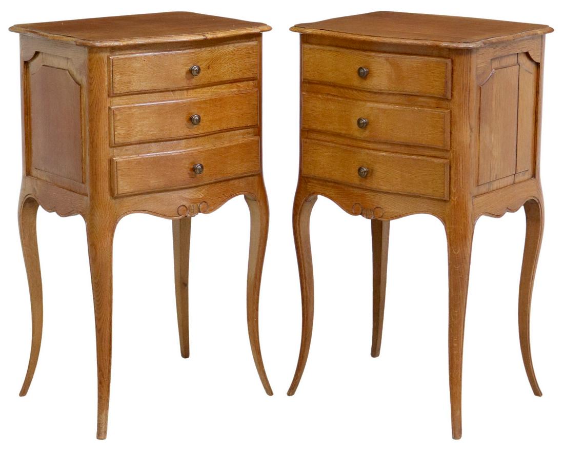 (2) LOUIS XV STYLE OAK THREE-DRAWER NIGHTSTANDS: (pair) Louis XV style oak nightstands, 20th c., having shaped top, over three drawers, scrolled apron, rising on tapered cabriole legs, approx 29"h, 16"w, 13"d Start Price: $150.00
