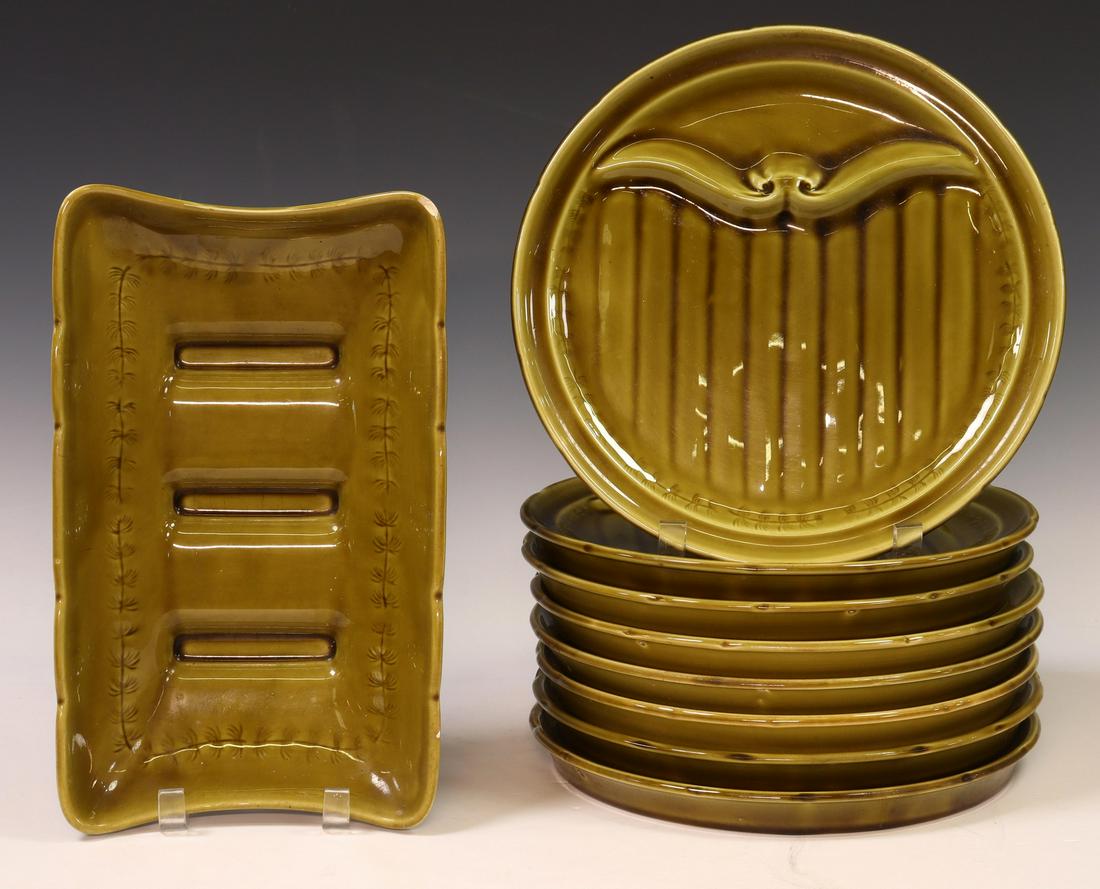 (9) FRENCH GIEN FAIENCE ASPARAGUS SERVICE: (lot of 9) French faience asparagus set, Gien, including: (8) plates, approx 10.75" diam; (1) rectangular cradle, chip to rim, approx 2.5"h, 12.25"w, 7.25"d; 18.5lbs total Start Price: $80.00