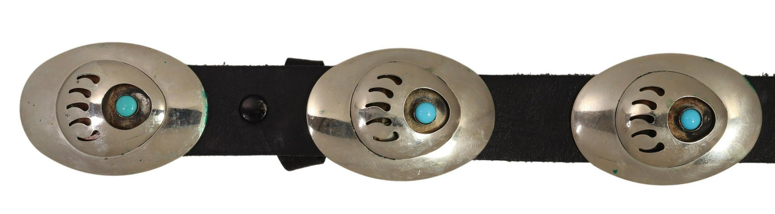 SK NATIVE AMERICAN SILVER BEAR CLAW CONCHO BELT: Native American silver (content unknown) concho belt, stamped SK (possibly Sam Kee, Navajo, 20thc.), having oval buckle, and eight conchos, each with pierced bear claw motif, centering turquoise color