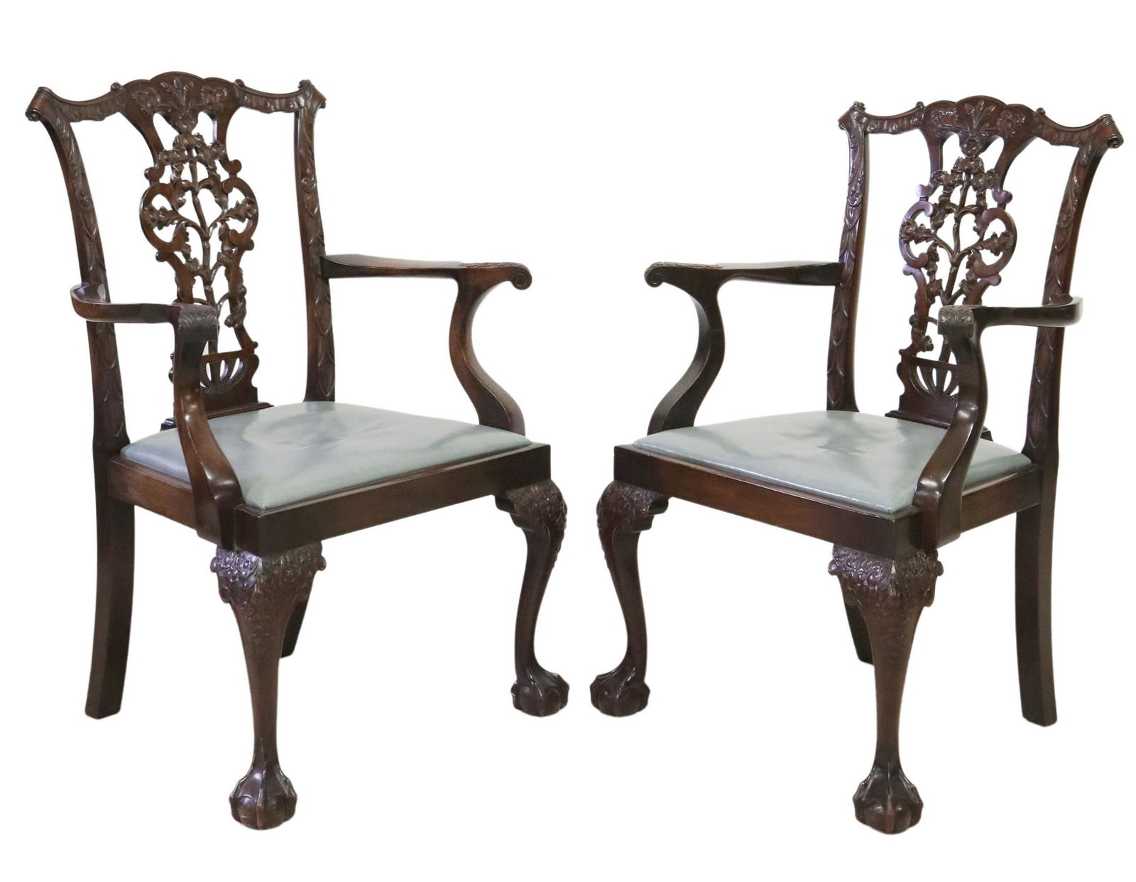 (2) GEORGE III STYLE CARVED MAHOGANY ARMCHAIRS: (pair) George III style mahogany armchairs, 19th/ 20th c., pierced splat with carved oak leaves, acorns, scrolled arms, slip seat, rising on cabriole legs with acanthus knees, ending in ball and claw 