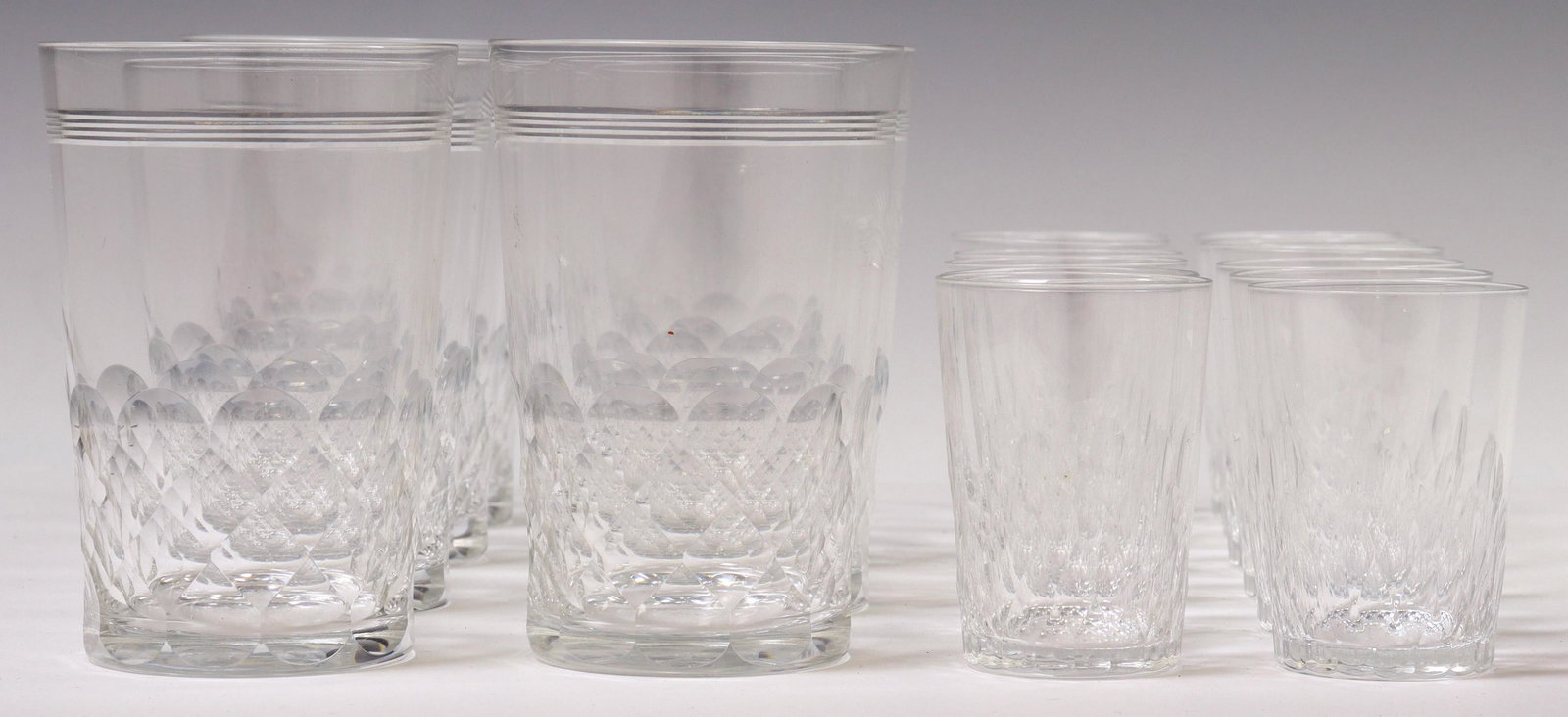 (19) FRENCH BACCARAT CUT CRYSTAL FLAT TUMBLERS: (lot of 19) French cut crystal flat tumblers, Baccarat, including: (7) "Ecailles & Filets" pattern, approx 3 5/8"h, 2 3/8"diam, (12) "Deauville" pattern, approx 2.25"h, 1 5/8"diam; 2.5lbs total Start 