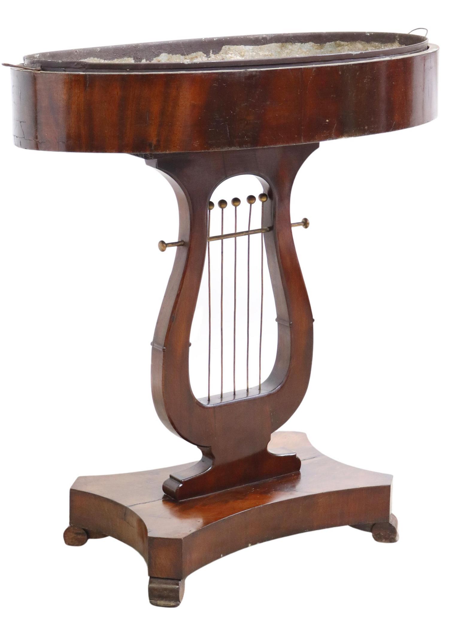 FRENCH EMPIRE STYLE MAHOGANY STANDING JARDINIERE: French Empire style mahogany standing jardiniere, 19th c., oval-form top, with inset metal liner, rising on lyre form standard, shaped base, ending on curved legs, approx 33.5"h, 30"w, 18"d Start Pric
