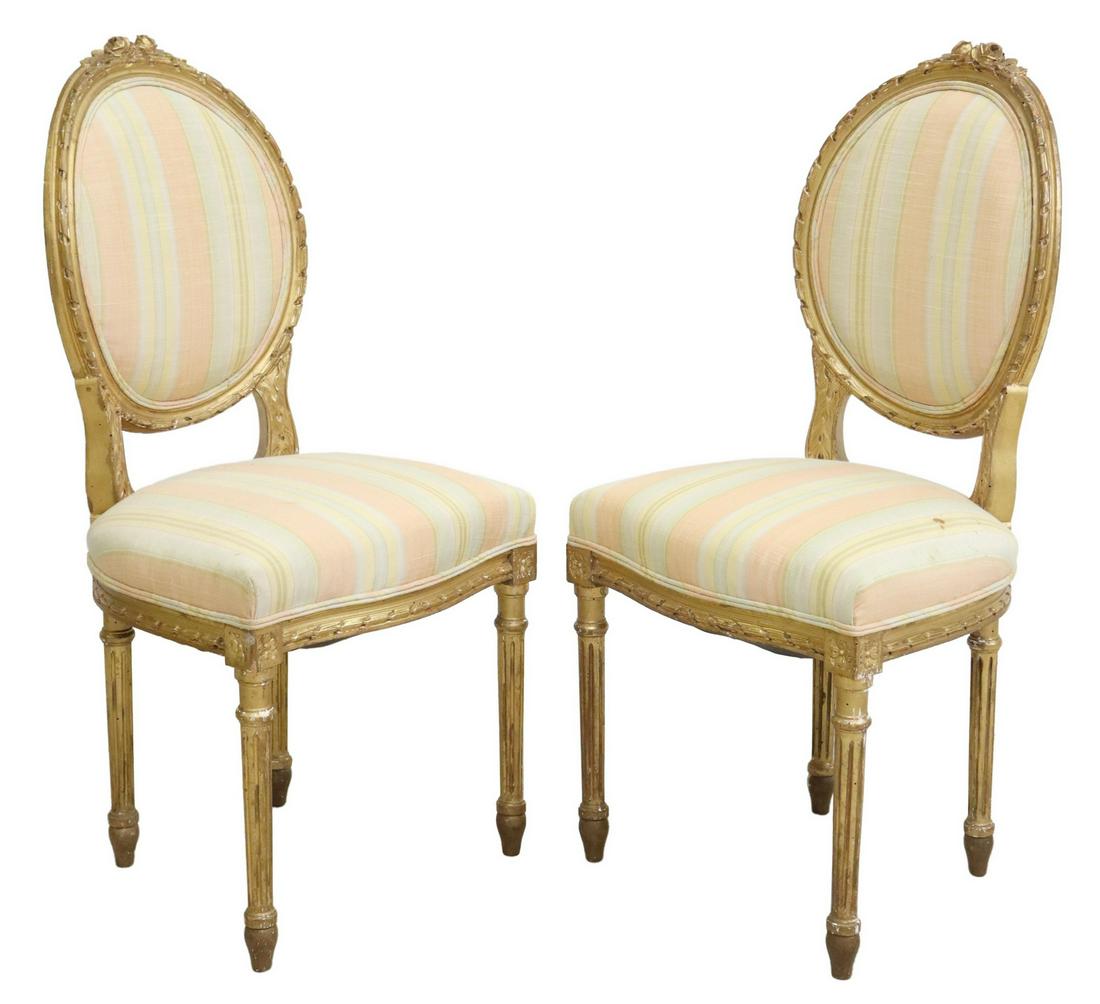 (2) FRENCH LOUIS XVI STYLE GILTWOOD SIDE CHAIRS: (pair) French Louis XVI style giltwood side chairs, 19th c., having floral crest, ribbon trim roundel back, rising on fluted and tapered legs, ending in blunt arrow feet, some spotting/ staining to up