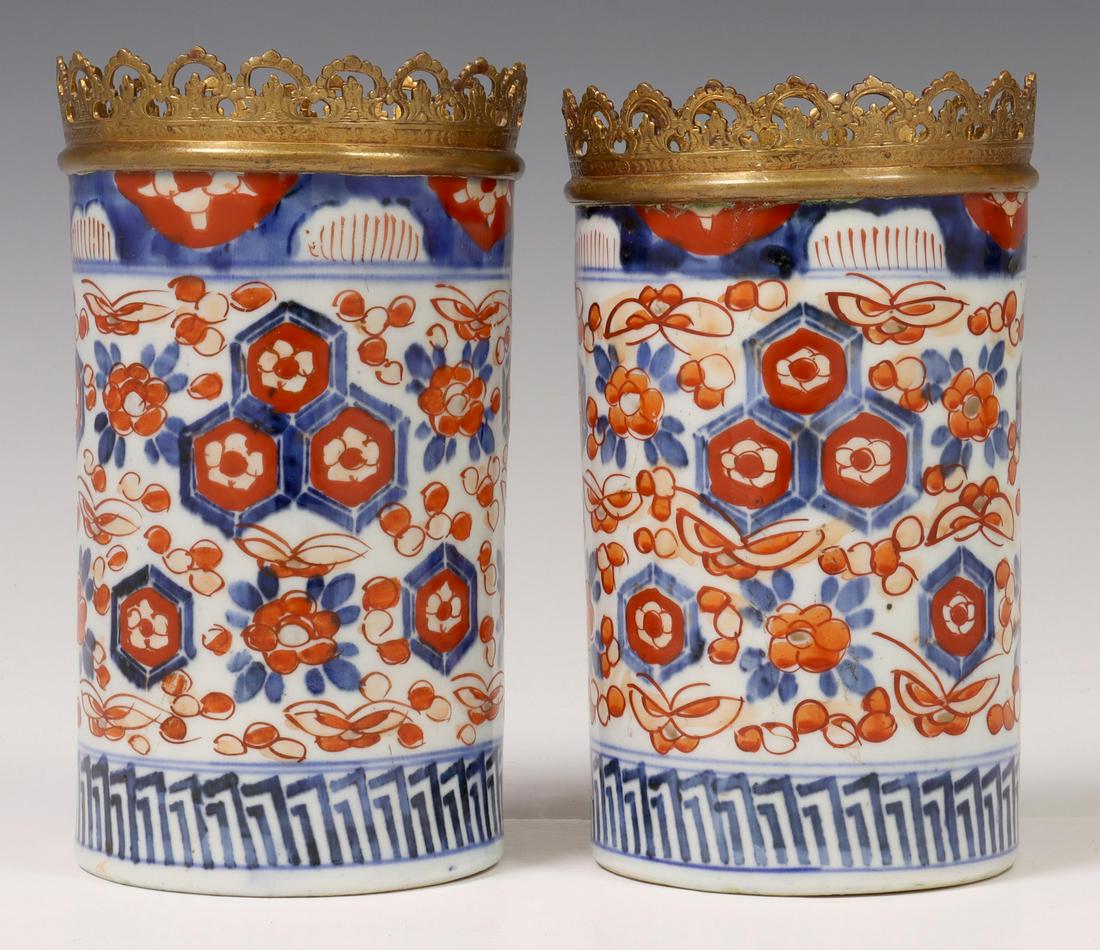 (2) GILT-METAL MOUNTED JAPANESE IMARI BRUSH POTS: (lot of 2) Japanese Imari porcelain brush pots, with gilt-metal mounted rims, approx 7"h, 4"diam; 3.5lbs total **Provenance: a Fine Santa Fe, New Mexico estate** Start Price: $80.00