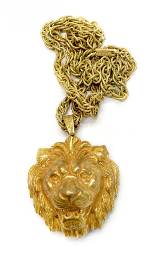 VINTAGEL MIRIAM HASKELL LION HEAD PENDANT NECKLACE: Vintage Miriam Haskell gilt metal lion head pendant having oval makers tag on filigree back, hung from a multi-link chain with 'Miriam Haskell' closure, pendant: 2"l, 1.75"w, chain: 24"l, .25lb