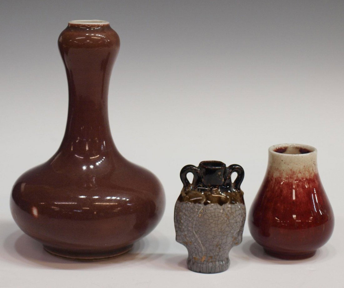 (3) CHINESE GLAZED PORCELAIN VASE GROUP: Lot of (3) Chinese porcelain vases: (1) small 19th c. Sang de Beouf, vase: 3" h; (1) 18th c., reddish-brown glazed garlic head vase, intact with hairline at rim, 6.25" h; (1) small vessel in a crackle
