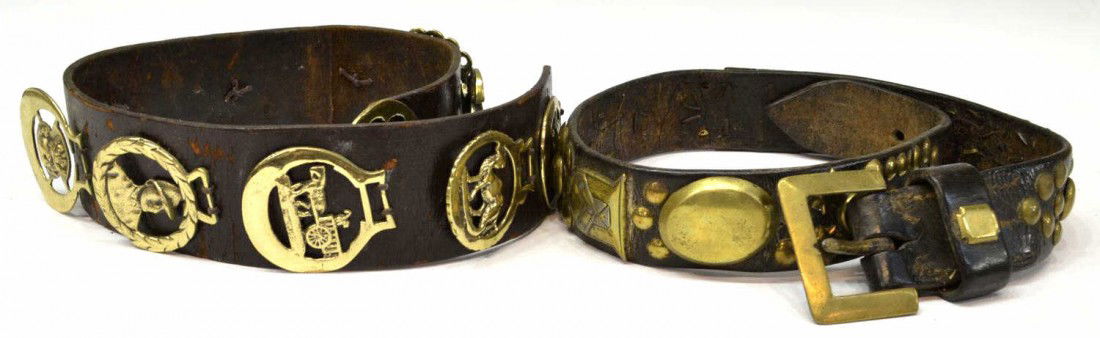 (2) HEAVY LEATHER BELTS MOUNTED WITH HORSE BRASSES: (lot of 2) British leather belts with horse brass and studs, comprising: (1) with (10) pierced horse brasses depicting, a ship, a camel, horse and carriage, a portrait, a bag of gold, a rooster, a sle