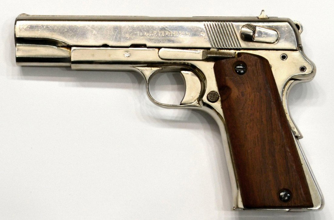 VIS RADOM CHROME FINISH PISTOL, 9MM, NAZI MARKS: Vis Radom pistol, Model 35, caliber 9mm parabellum, 8 round magazine, chrome finish, safety grip, walnut grips, Nazi eagle stamped at left and right, SN A3XXX ***Note: This firearm must be transferred