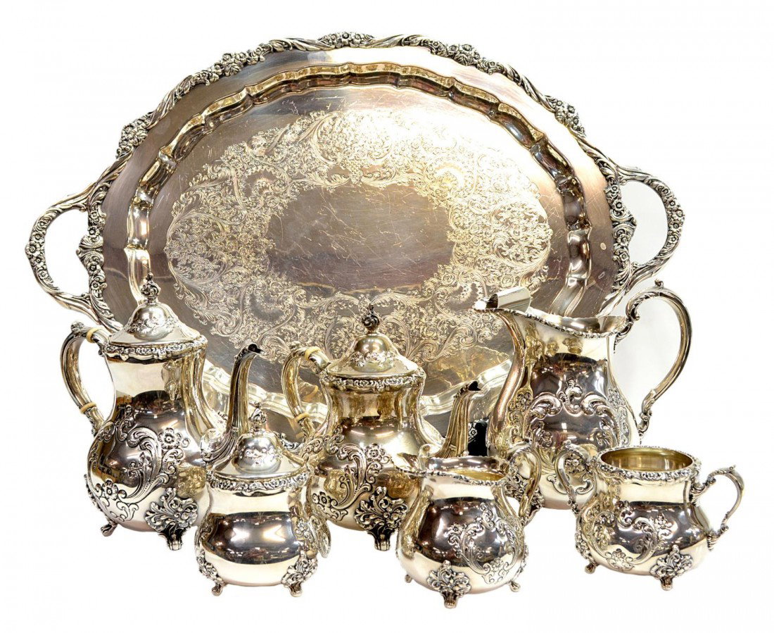 POOLE OLD ENGLISH ROSE STERLING TEA/COFFEE SERVICE: (lot of 7) A Poole sterling silver tea and coffee service, hand chased in the 'Old English Rose' pattern, comprising (six-pieces), (1) coffee pot, 9.75"h, (1) tea kettle, 8.75"h, (1) ice water pitcher