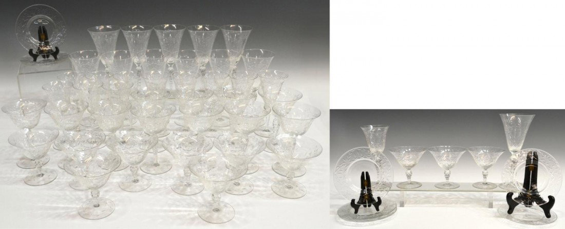 (57) FINELY ETCHED COLORLESS CRYSTAL STEMWARE: (set of 56) Finely etched crystal stem and tableware, delicate motif featuring leafy floral sprays on the bowl of each raised on cut stems and foliate etched pedestal foot, comprising: (11) large gobl