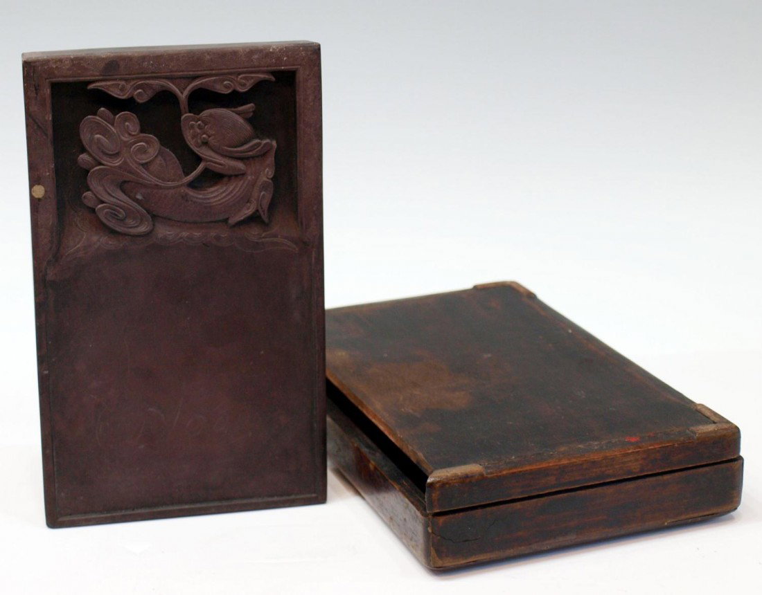 CHINESE DRAGON FISH INK STONE & WOOD BOX: Chinese inkstone in wood case, Qing Dynasty, the rectangular stone carved at the upper section with a dragon fish, case with loss of trim at one side 1.25" h, 5.5"w, 9"d, cased: 2"h, 6.5"w, 10.125"d, 
