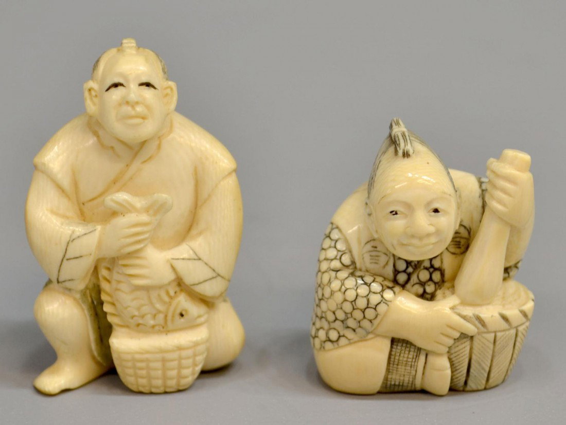 (2) JAPANESE CARVED IVORY NETSUKE, SIGNED: **This item will not be shipped Internationally** (lot of 2) Japanese carved ivory netsuke, both with makers marks: (1) formed as a man holding a fish over a basket; (1) formed as a seated man holding