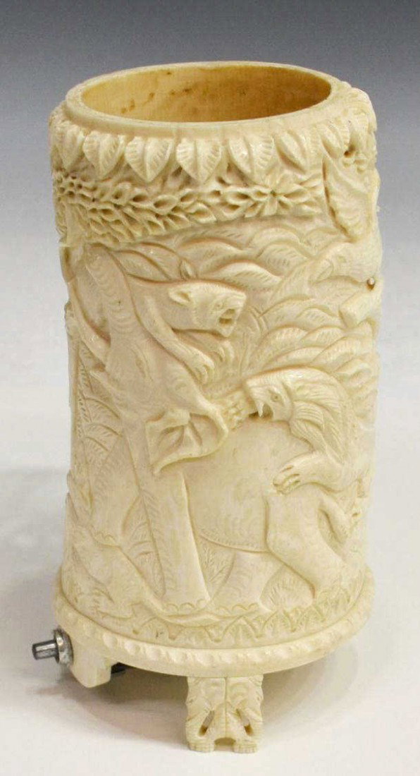 CARVED IVORY TUSK LAMP, TIGER & ELEPHANT BATTLE: ** This item will not be shipped internationally** Carved ivory tusk lamp, in relief depicting a jungle theme with lions and tigers attacking elephants, detailed trees and foliage, three elephant head
