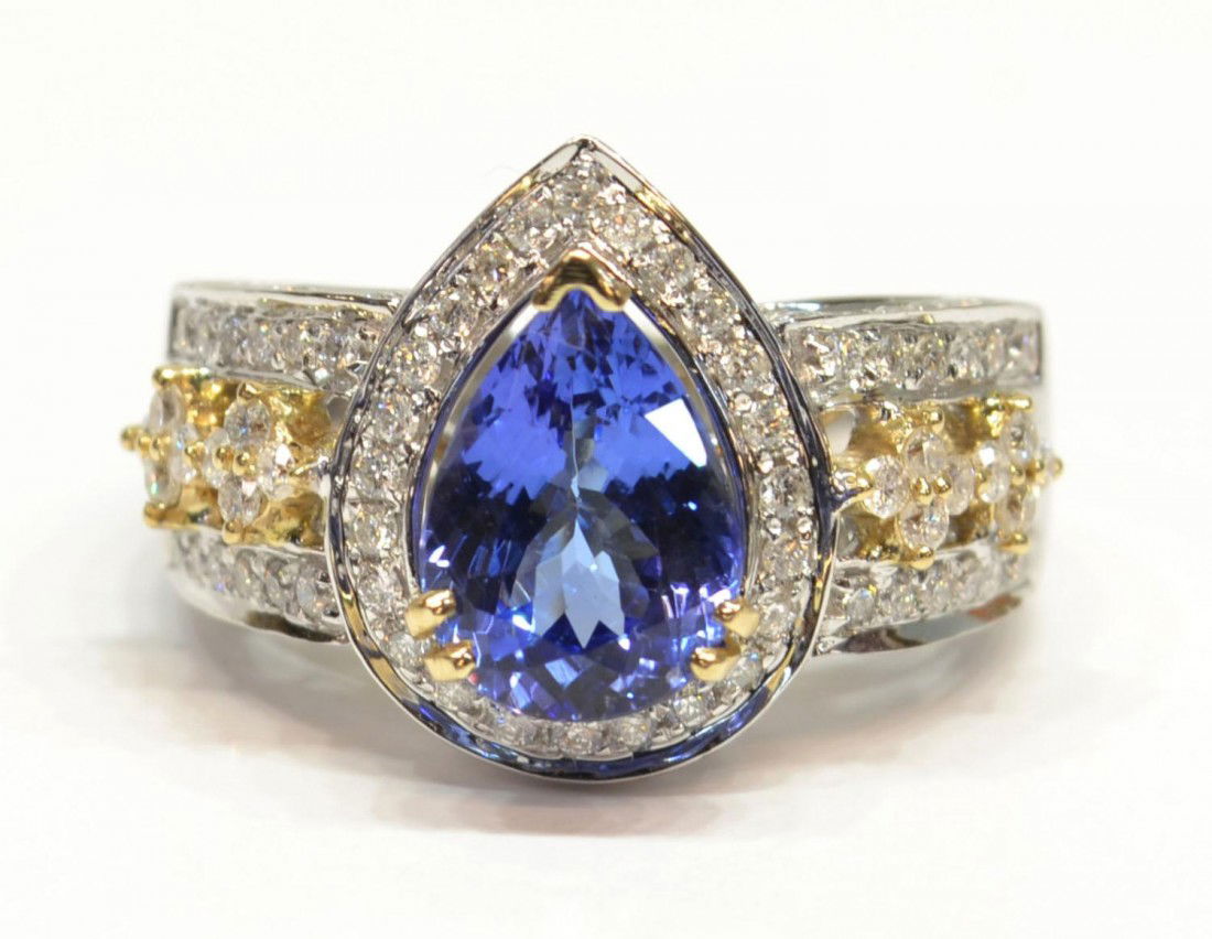 LADIES 14KT GOLD, DIAMOND & 2.73 CT TANZANITE RING: Ladies 14KT white gold cast tanzanite and diamond ring, featured tanzanite is set within a diamond lattice gallery, supported by diamond set shoulders and completed by a 4mm wide band, bright polish f