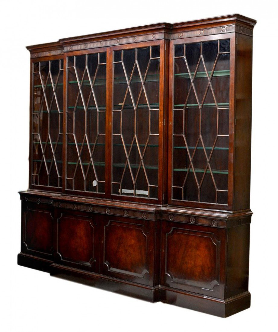 BAKER FURNITURE COMPANY BREAKFRONT COMPANY,: Baker Furniture Company lighted mahogany breakfront cabinet, having a stepped cornice over four astragal glazed doors, adjustable interior glass shelves, four lower doors, all set on the conforming ba