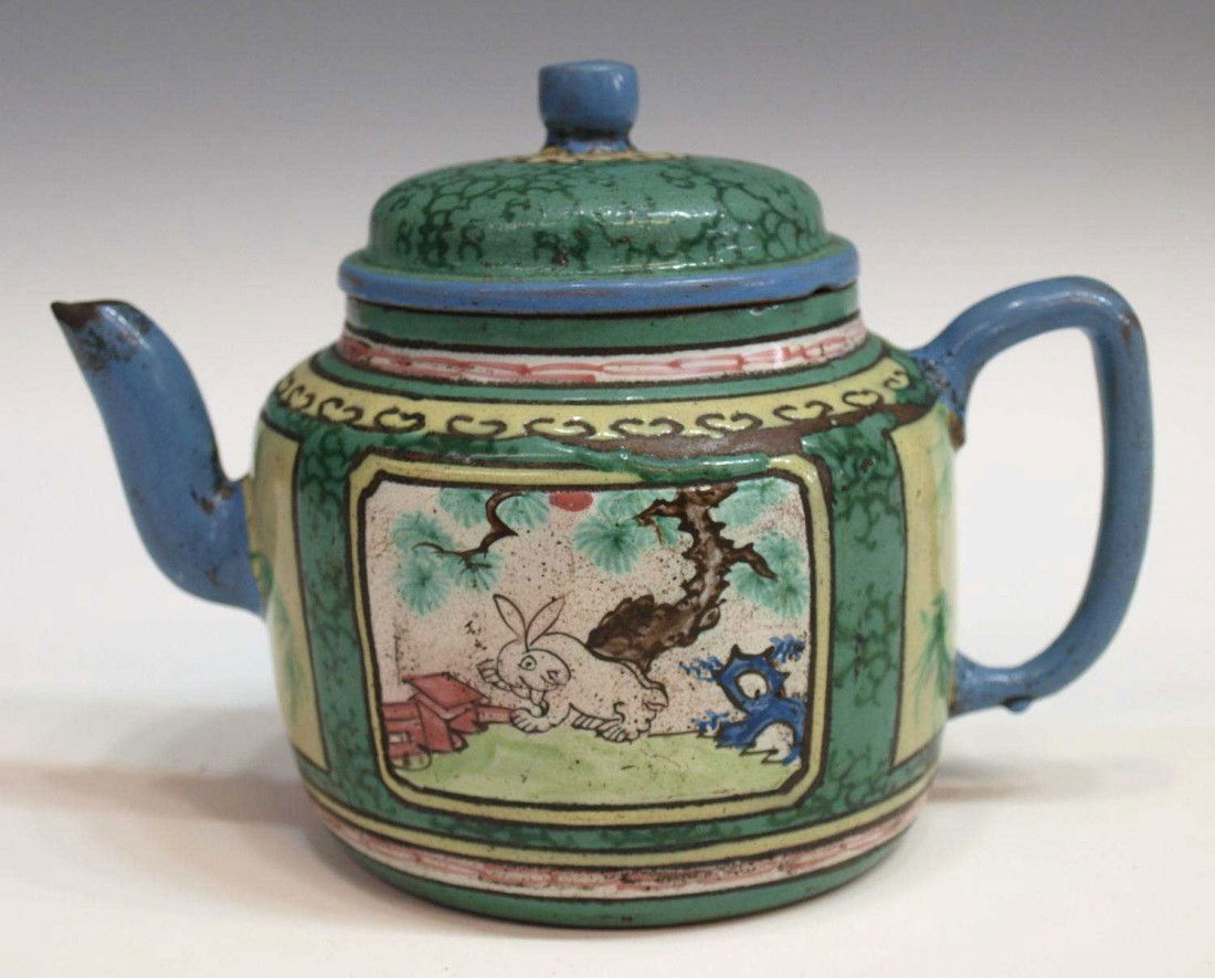 19TH C CHINESE REDWARE ENAMELED RABBIT TEAPOT: Chinese enameled Redware teapot, late 19th c., polychrome enamel decoration, reserves showing flowering branches, bamboo and a rabbit under pine on the body with, blue spout and handle, hairlines to p