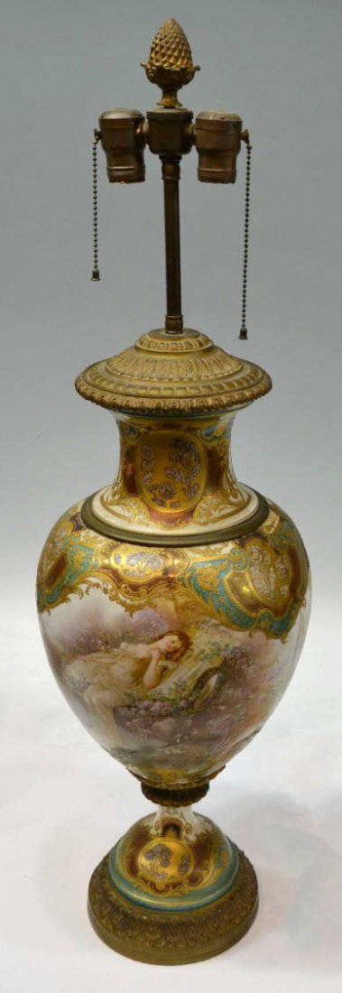 LARGE SEVRES HANDPAINTED TABLE LAMP URN, E. COLLOT: Large Sevres parcel gilt porcelain baluster urn, 19th c., signed in reserve E. Collot, elaborate hand painted scenes depicted in soft purples, pinks, sage green and earth tones, a young love struck wo