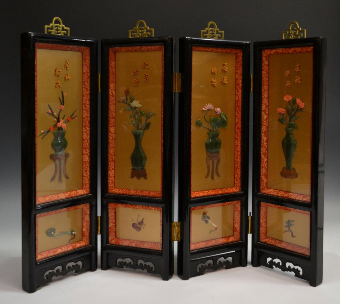 CHINESE LACQUER TABLESCREEN, HARDSTONE MOUNTINGS: Chinese four panel table screen with hardstone mountings, the black lacquer frame painted with foliage, each rectangular panel mounted with red coral, jade, rose quartz, etc. forming flowering vases u