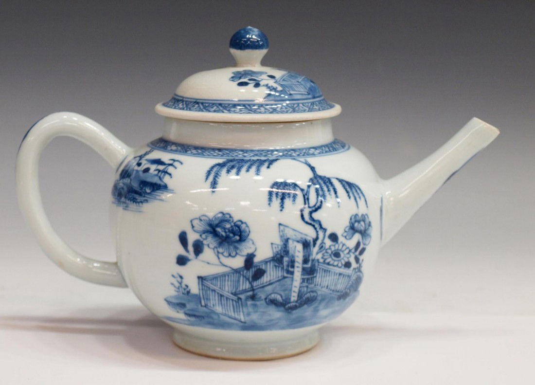 CHINESE NANKING CARGO PORCELAIN TEAPOT, C. 1750: Chinese 'Nanking Cargo' porcelain blue and white teapot, Qing dynasty, c. 1750, of globular form with domed lid and straight spout,decorated with a fenced terrace on a rocky riverbank with a willow an