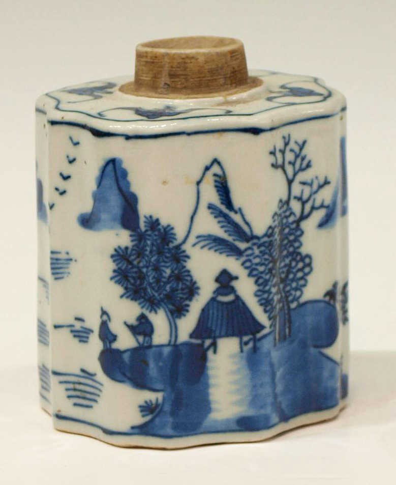 CHINESE QING DYNASTY PORCELAIN TEA CADDY: Chinese underglaze blue decorated tea caddy, Qing Dynasty, possibly Daoguang (1821-1950), a surround of bats at top, lacking cover, the shaped body decorated with pagodas and figures and river backed 