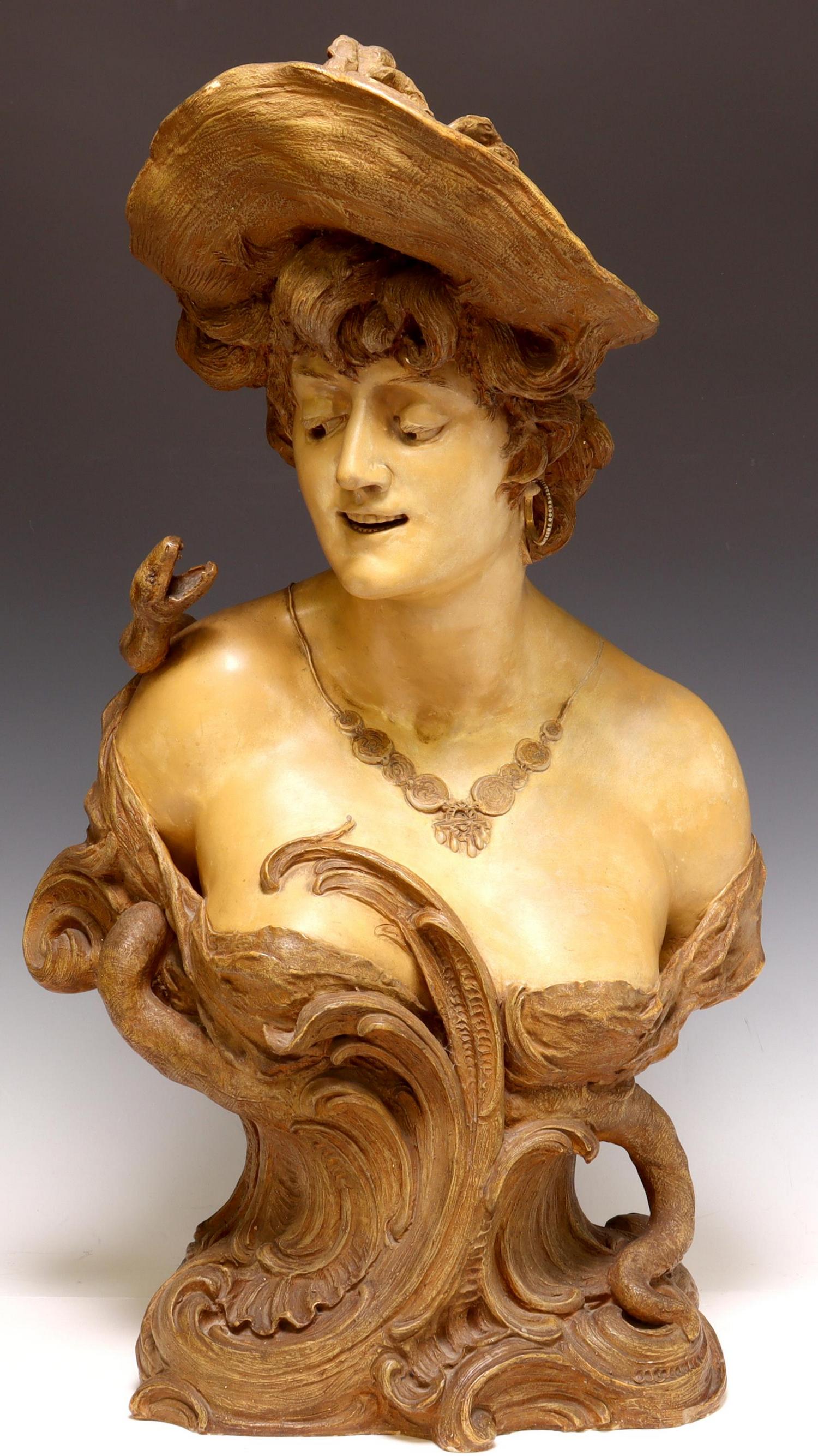 ART NOUVEAU TERRACOTTA BUST WOMAN & SERPENT: Art Nouveau terracotta bust, woman with serpent, on a rocaille base, impressed mark with bridge, loss to necklace, lacking one earring, approx 27"h, 30lbs Start Price: $300.00