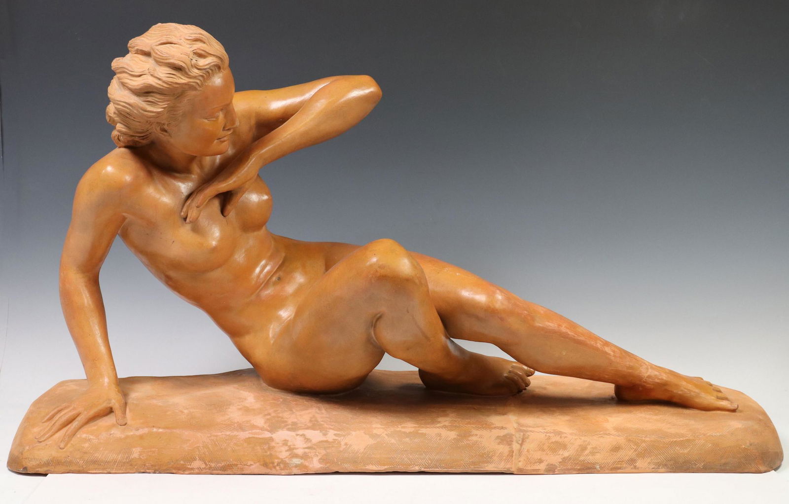 AFTER A. BROCHARD TERRACOTTA FIGURE RECLINING NUDE: French terracotta sculpture, Reclining Female Nude, signed after A. Brochard, restoration at base and left ankle, approx 18.75"h, 33.5"w, 13"d Start Price: $300.00