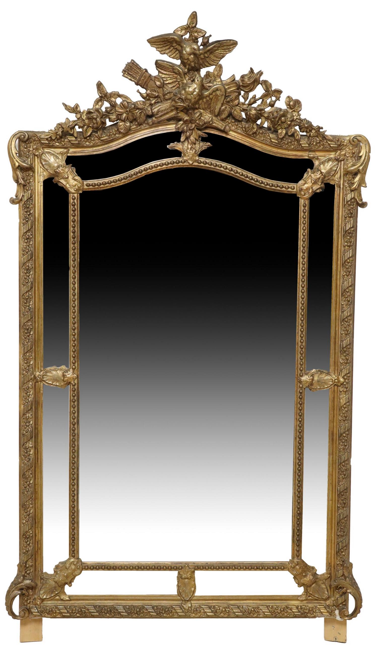FRENCH LOUIS XVI STYLE GILT PARCLOSE WALL MIRROR: French Louis XVI style gilt parclose wall mirror, 19th c., having dual bird in torch and quiver crest, over foliate and ribbon frame, encasing flat mirror plate, some typical small losses and later pa