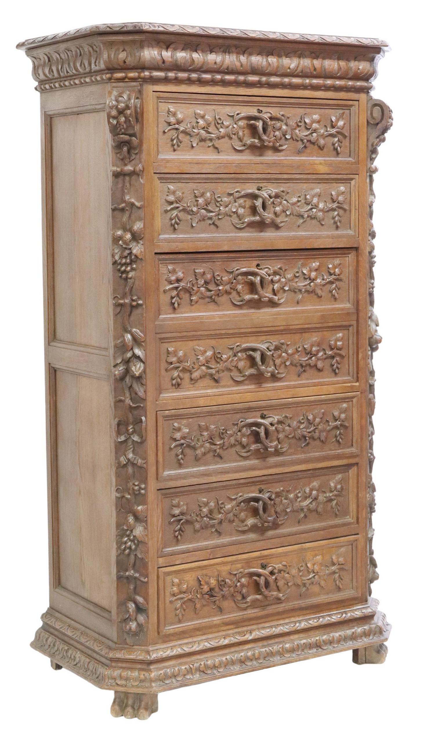 FRENCH HENRI II STYLE OAK SECRETAIRE A ABATTANT: French Henri II style oak secretary, 19th c., lunette border, carved with raised vines, five drawers, centering concealed drop-front, opening to interior gallery with worn inset leather writing surfac