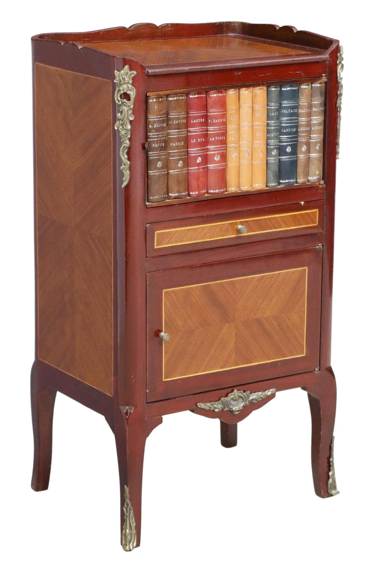 LOUIS XV STYLE LEATHER BOOK SPINE NIGHTSTAND: Louis XV style matched veneer nightstand, early 20th c., having shaped top with inlaid banding, over single cabinet door with book spine front, all leather bound with gilt embossed lettering, above si