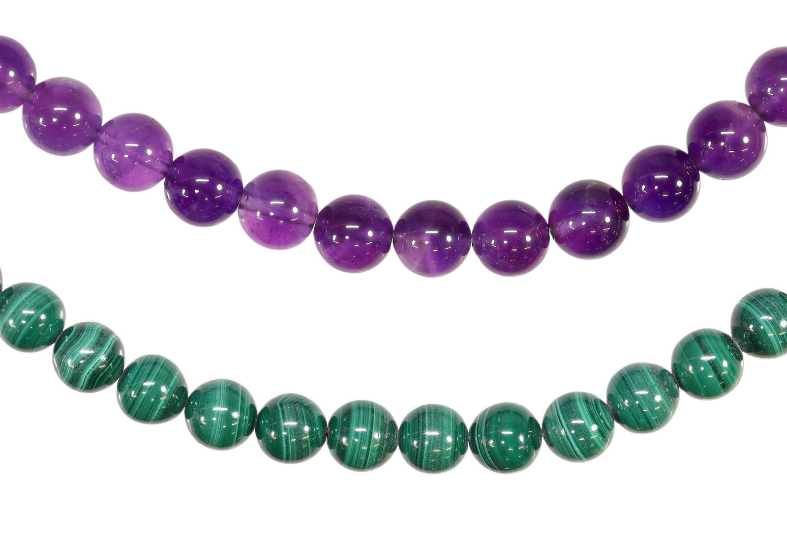 (2) STRANDS OF ROUND MALACHITE & AMETHYST BEADS: (lot of 2) Strands of round beads, including: (1) malachite, approx 27.5"l, (1) amethyst, approx 25.75"l; 210.8 grams total Start Price: $125.00